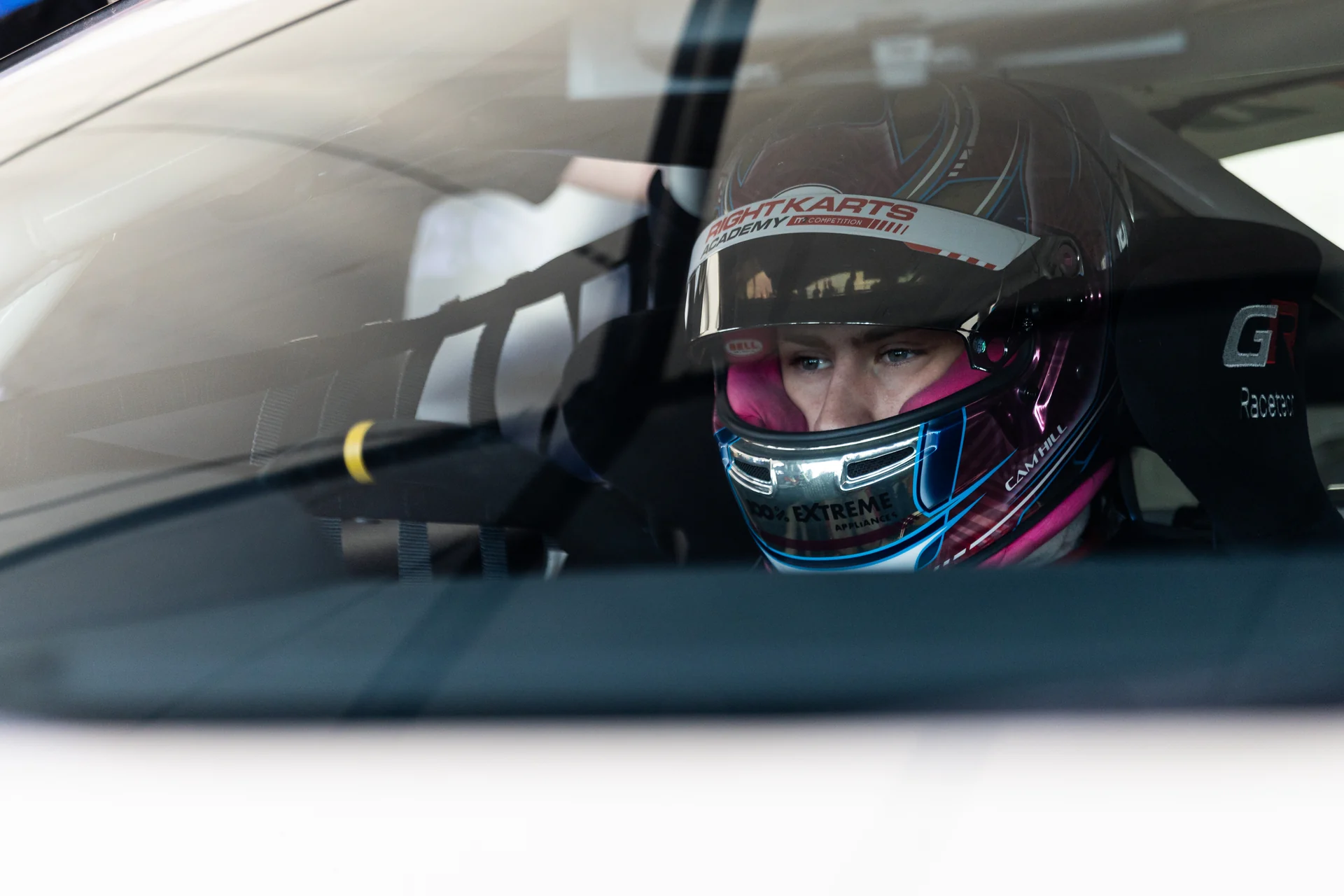 Cameron Hill strapped into the GR86, visor up