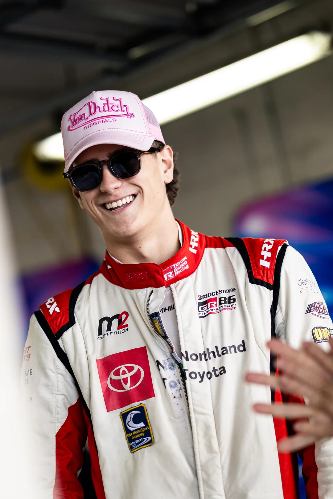 Cameron Hill smiling in the garage at Manfeild