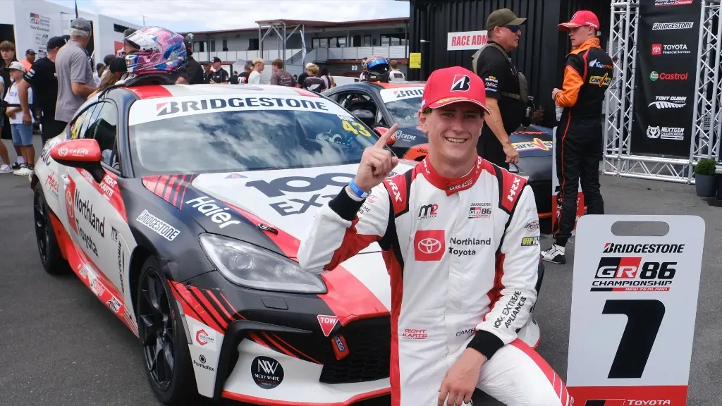 Cameron Hill celebrating a race victory at Hampton Downs